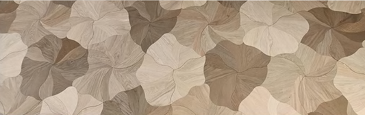 Close-up of Rovene engineered hardwood showing curved wood-grain segments and petal formations – SAIBA Homes.