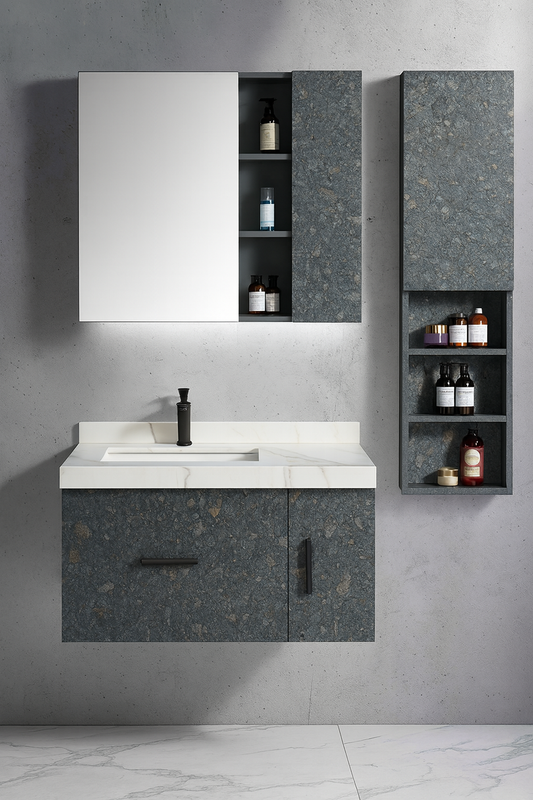 Stonel wall-mounted vanity with stone-textured cabinet fronts, white integrated basin, black hardware, and matching storage cabinets – SAIBA Homes.
