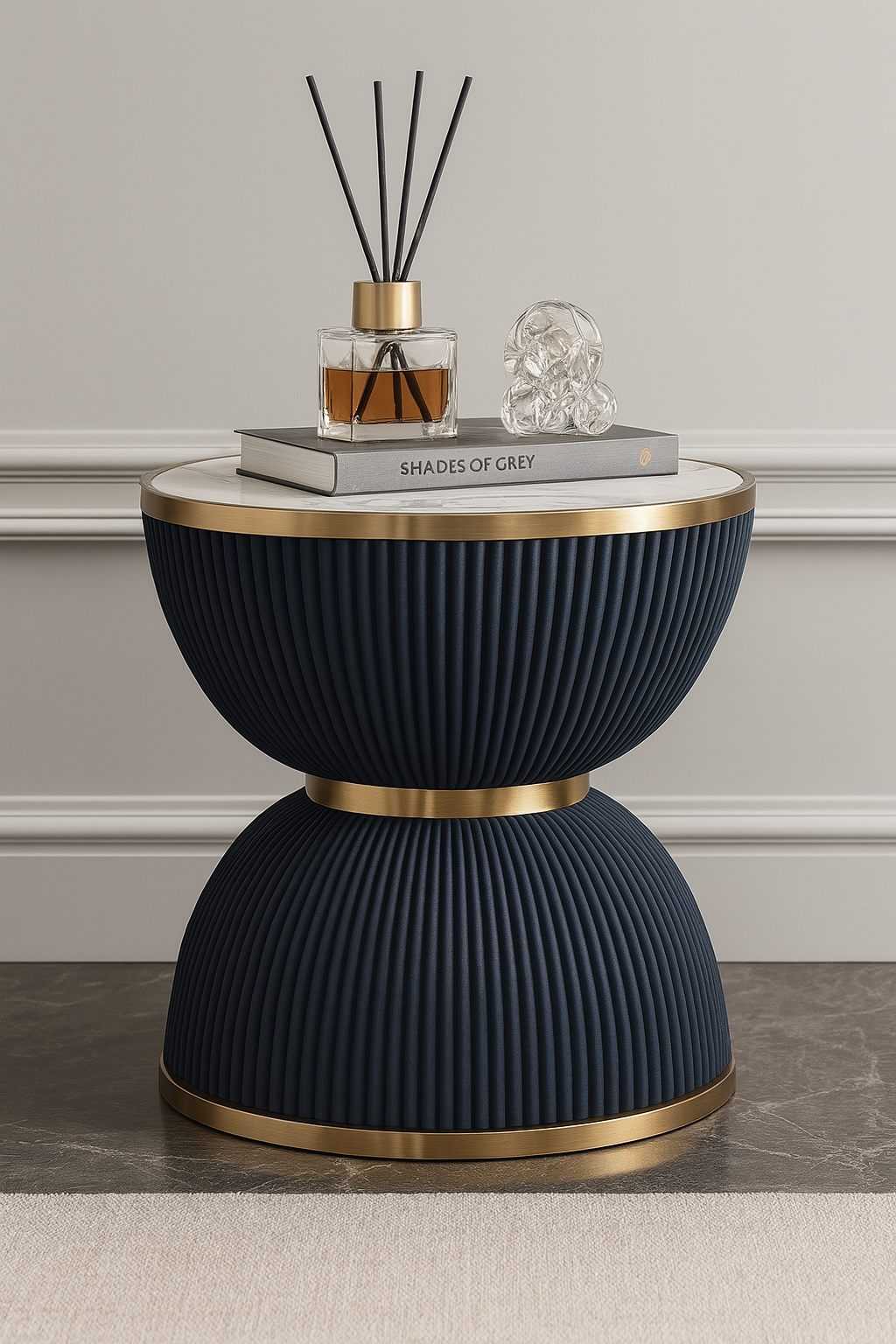 Black side table with gold accents, featuring a diffuser and book on a neutral background