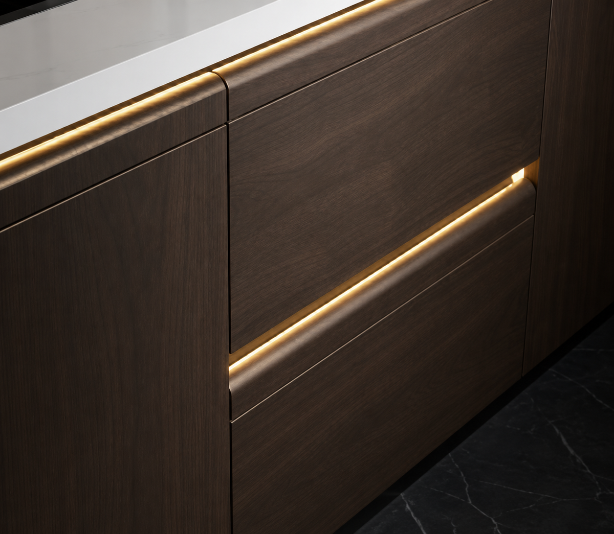 Close-up of modern dark wood kitchen cabinetry with a white countertop and warm LED under-light striping.