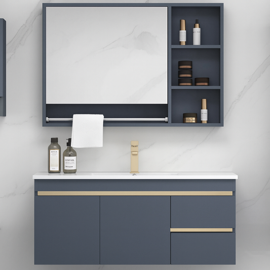 Modern wall-hung blue vanity with soft-close drawers and brushed gold handles. SAIBA Homes