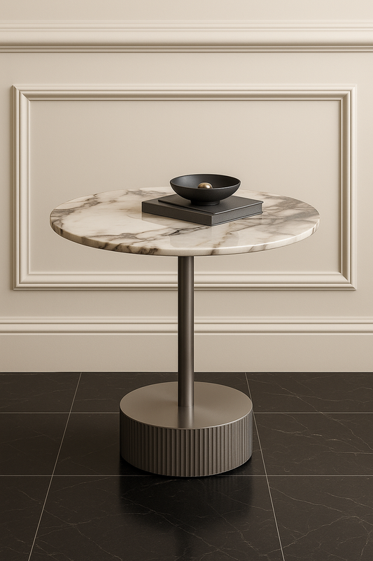 Marble-top side table with a black bowl on a beige wall background