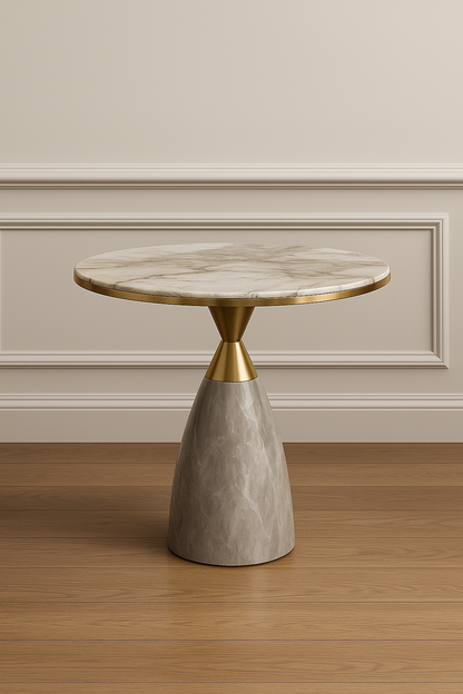 Round side table with marble top and concrete base against a neutral wall.