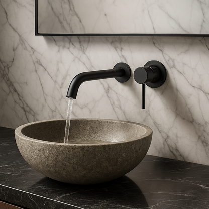 Matte black wall-mounted faucet with modern round handle