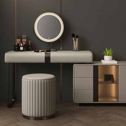 Modern vanity setup with a round mirror, bench, and cabinet against a dark wall.