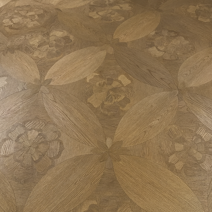 Close-up of Fleuron engineered wood flooring with sculpted botanical and petal pattern, Walnut/Oak finish – SAIBA Homes