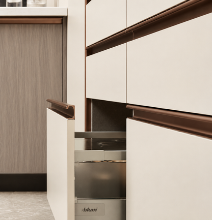 A close-up of modern kitchen cabinetry with white drawer fronts and dark brown handles, with one drawer pulled open to reveal a stainless steel interior. The brand name 'ibham' is visible on the bottom edge of the open drawer.