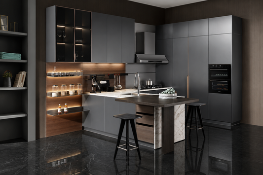 A modern kitchen interior with dark gray cabinets, a central island with a marble-look base, black bar stools, built-in appliances, and warm under-cabinet lighting on a dark reflective floor.
