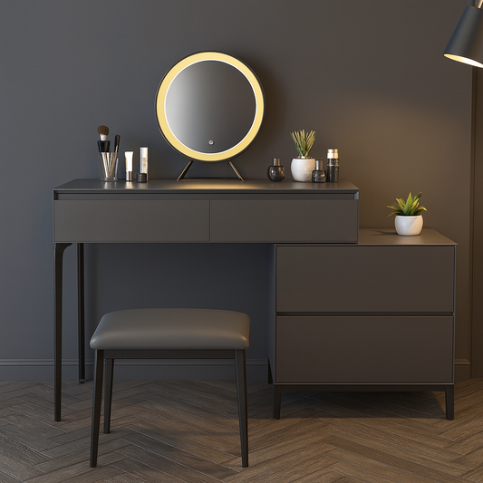 Dressing table with round mirror, stool, and decorative items against a dark wall.