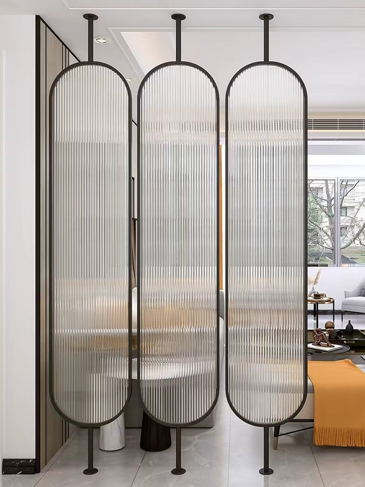 Ceiling-mounted translucent acrylic wall partition creating separation in an open-concept room
