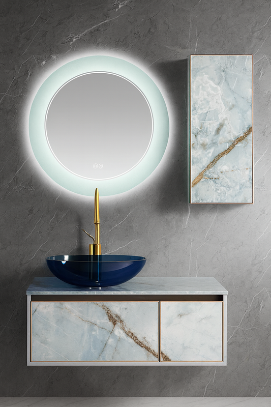 Blue marble-look floating vanity with sapphire glass vessel basin, gold faucet, and circular LED backlit mirror – SAIBA Homes.