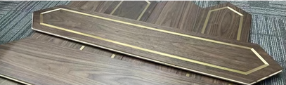Angle view of Rivoli flooring planks with geometric gold accents highlighting craftsmanship, SAIBA Homes.