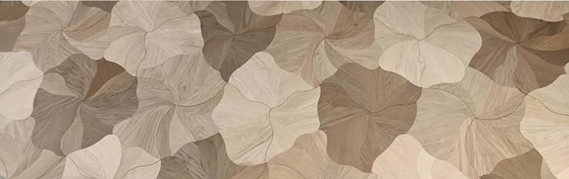 Close-up of Rovene engineered hardwood showing curved wood-grain segments and petal formations – SAIBA Homes.