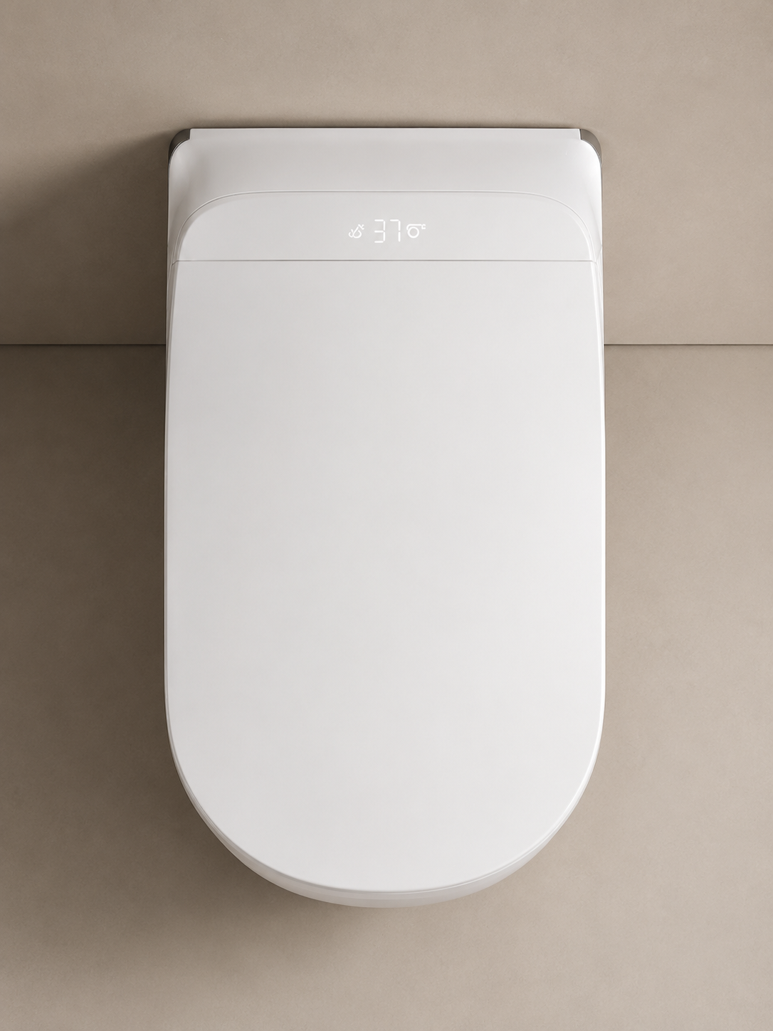 A top-down view of a white wall-mounted toilet with a closed lid, set against a minimalist beige tiled background.