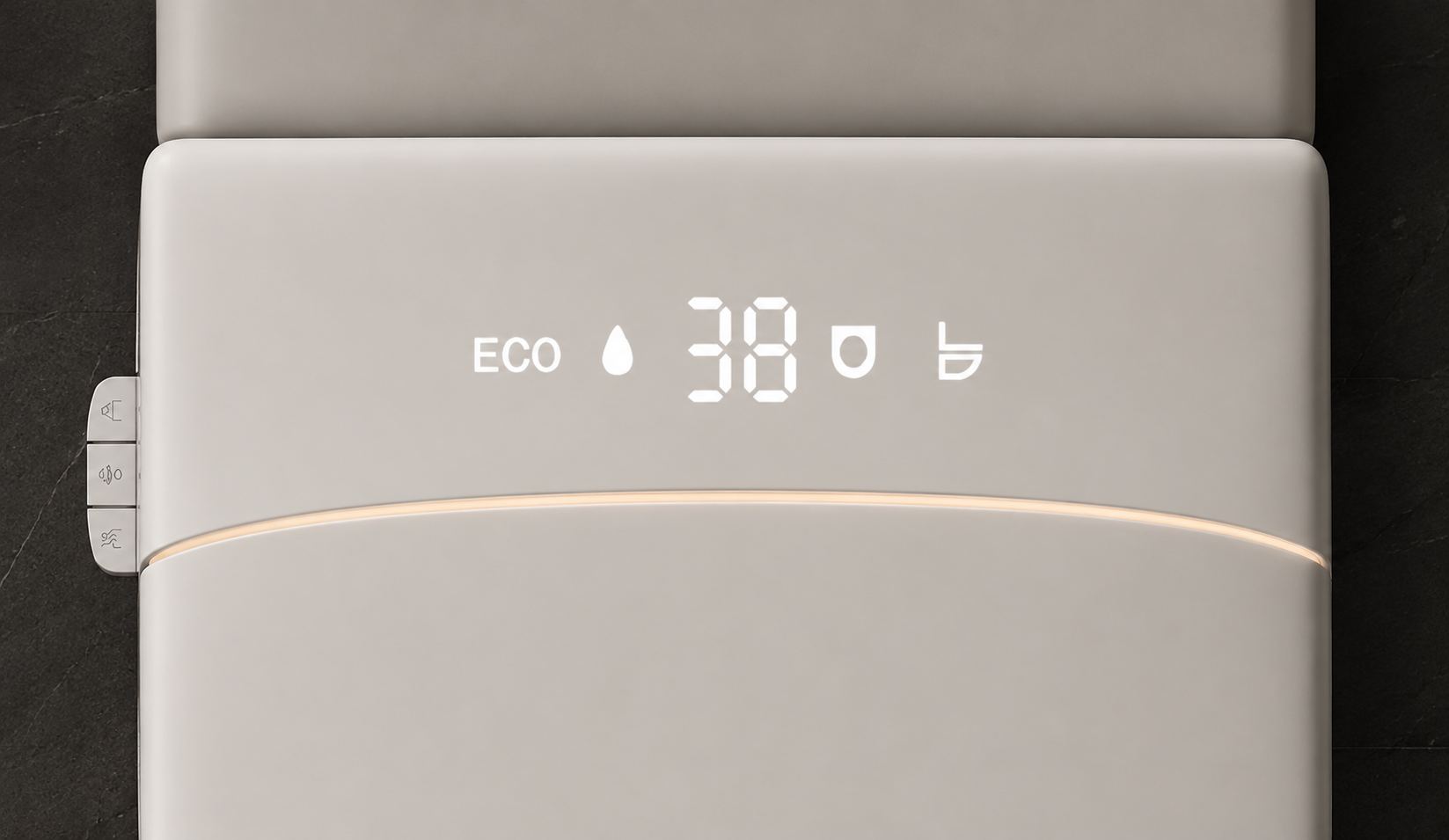 Close-up of a light beige or off-white electronic device with a digital display showing 'ECO 38' and small icons, resting on a dark textured surface.