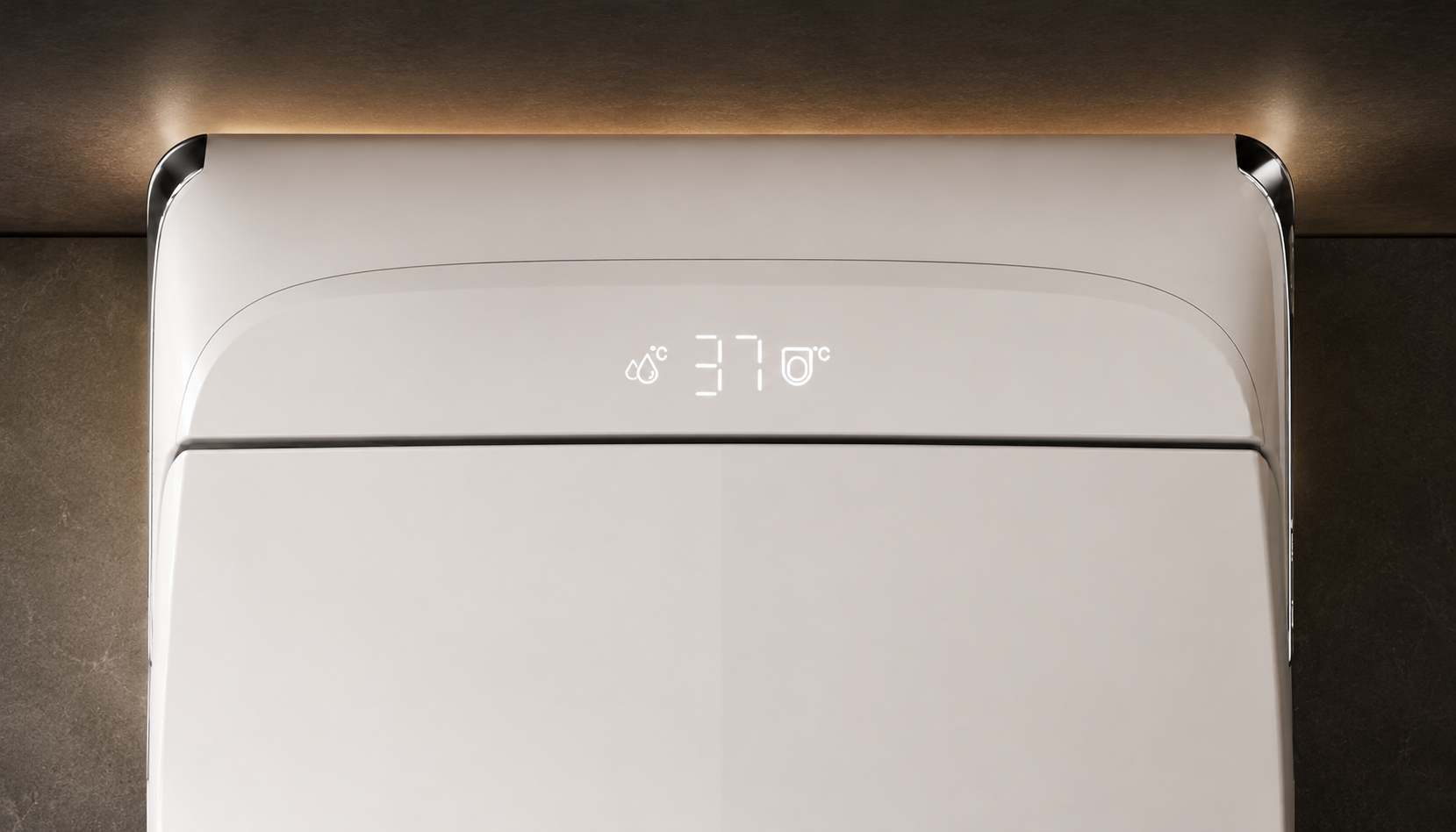Close-up of a white modern wall-mounted appliance, likely a humidifier or heater, with a small digital temperature display showing 37 degrees Celsius, set against a dark textured wall with warm ambient lighting.