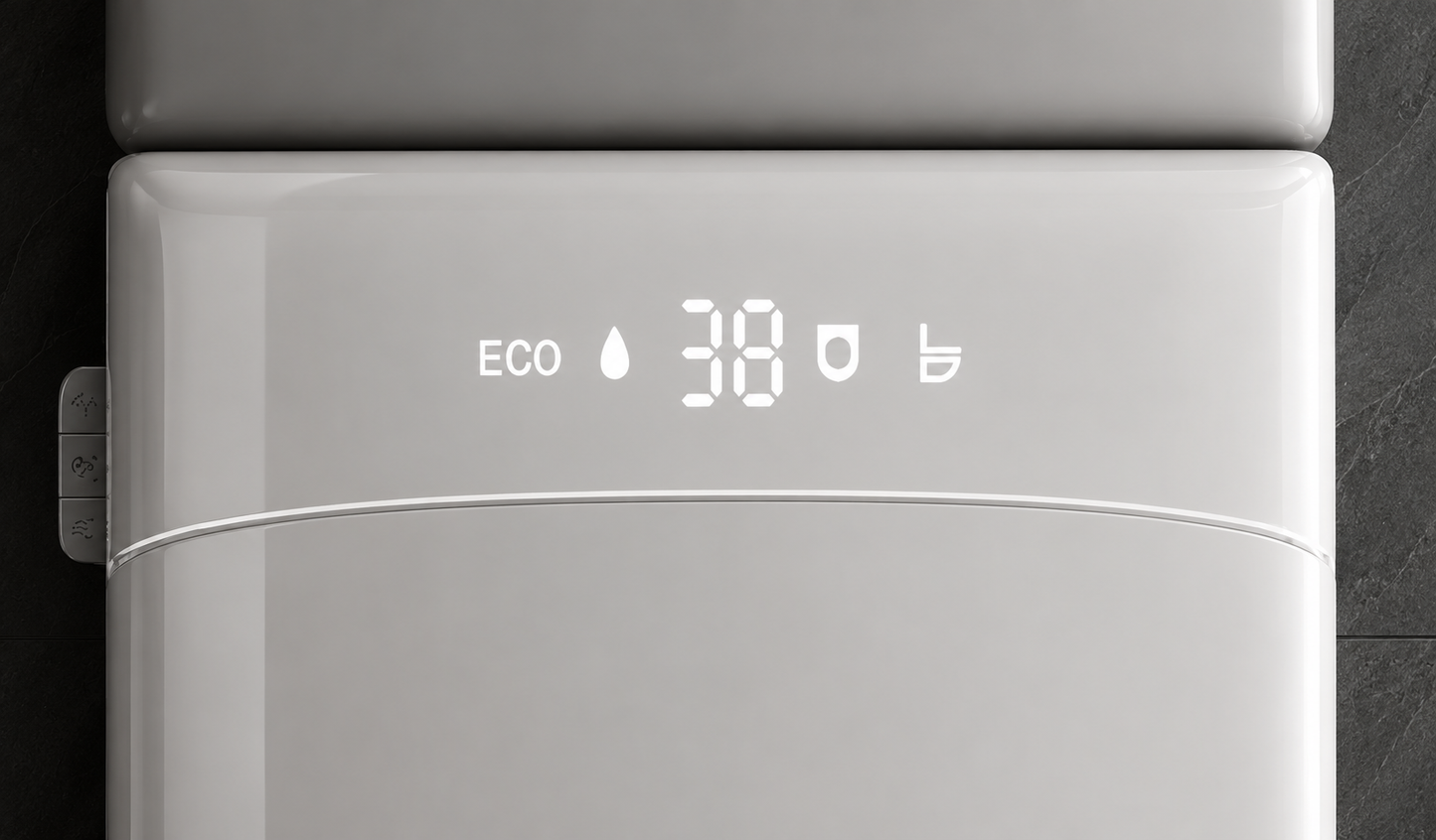 Close-up of a modern white appliance front panel with a digital display showing ECO and 38, photographed against a dark background.