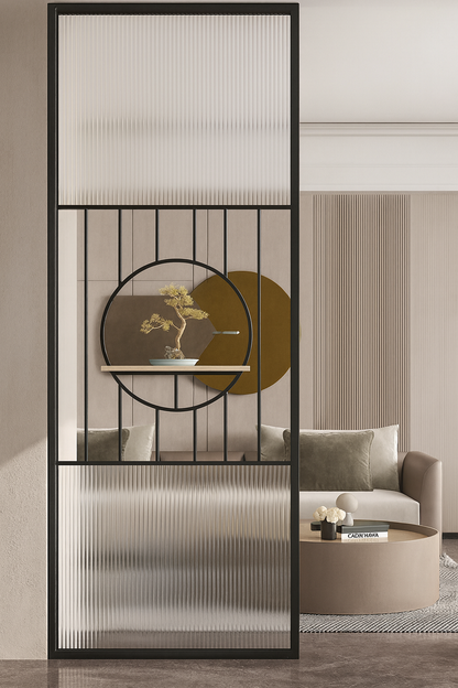 Zen-inspired glass and metal partition featuring circular accent shelf, installed in a modern neutral interior.