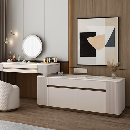 Modern interior design with a dresser, mirror, and abstract art on a wall.