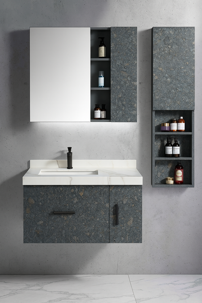 Stonel wall-mounted vanity with stone-textured cabinet fronts, white integrated basin, black hardware, and matching storage cabinets – SAIBA Homes.