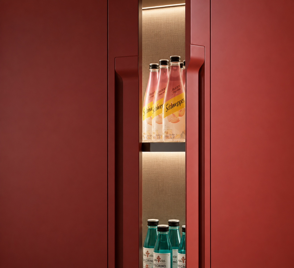 A modern red beverage refrigerator or wine cooler with illuminated shelves, stocked with pink and blue glass bottles, shown against a matching red exterior.