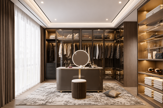 A luxury modern walk-in closet room with a vanity desk, round mirror, and matching stool, set in a highly styled interior with clothing racks, shelving, and warm lighting.