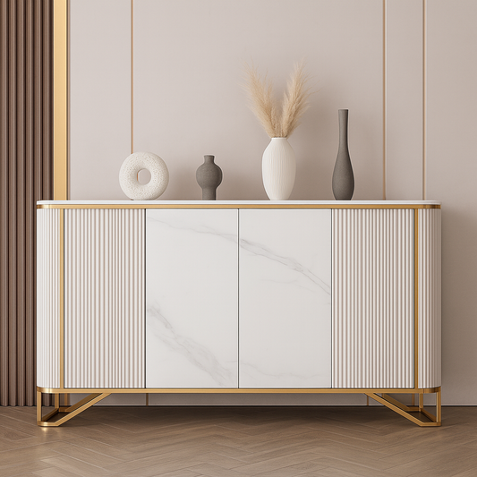 Modern white console with gold detailing and fluted design against a neutral wall