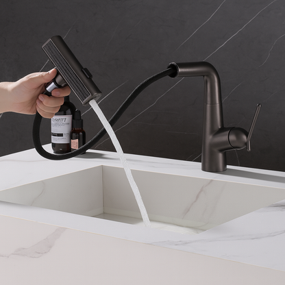 Varis pull-out bathroom faucet spray over white rectangular basin