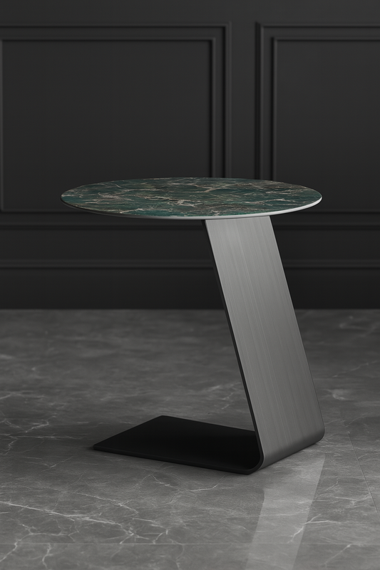 Modern side table with marble top and metal base against a dark wall.