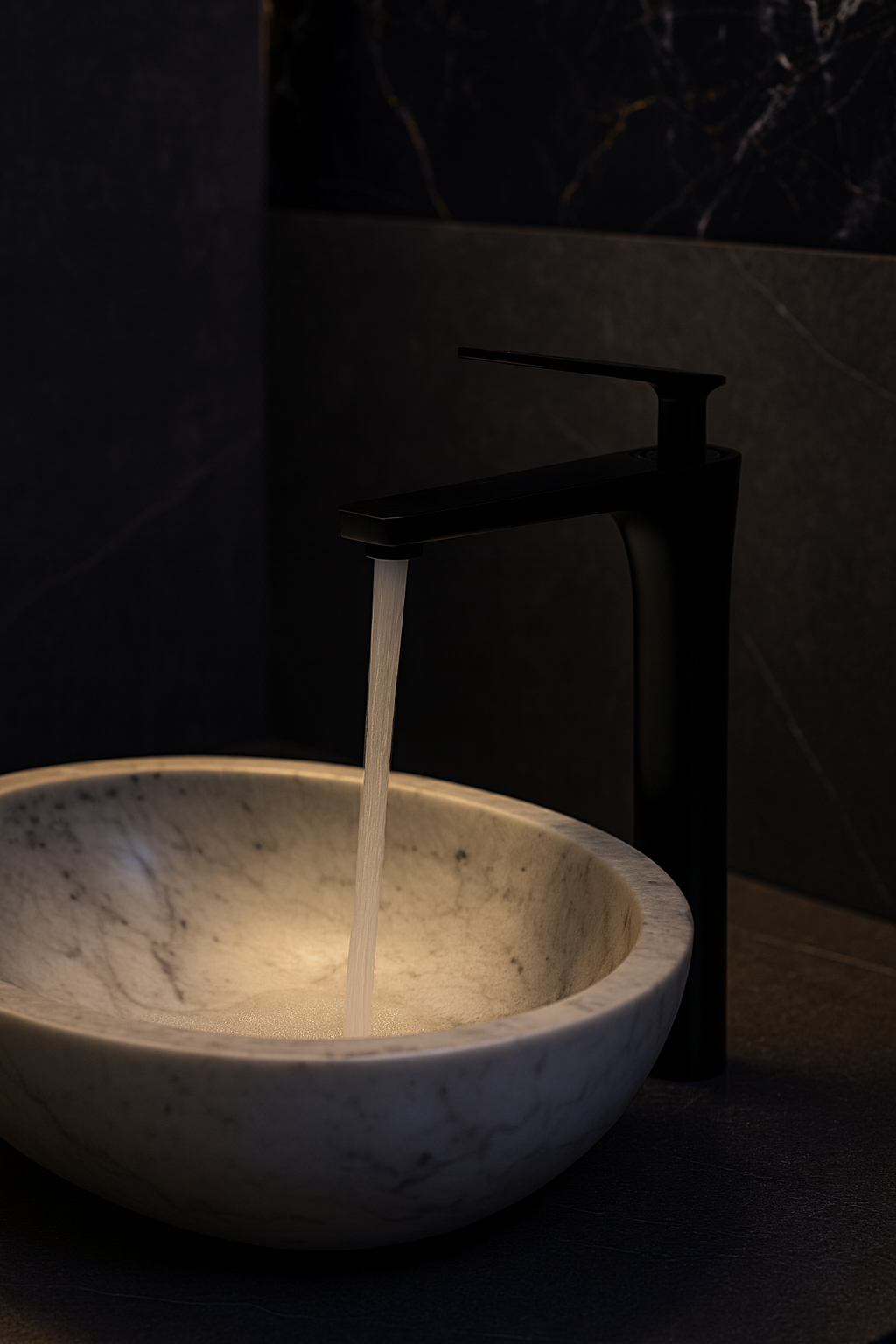 Black Veynor Tall Faucet installed with dark stone countertop – modern luxury style moody aesthetic.